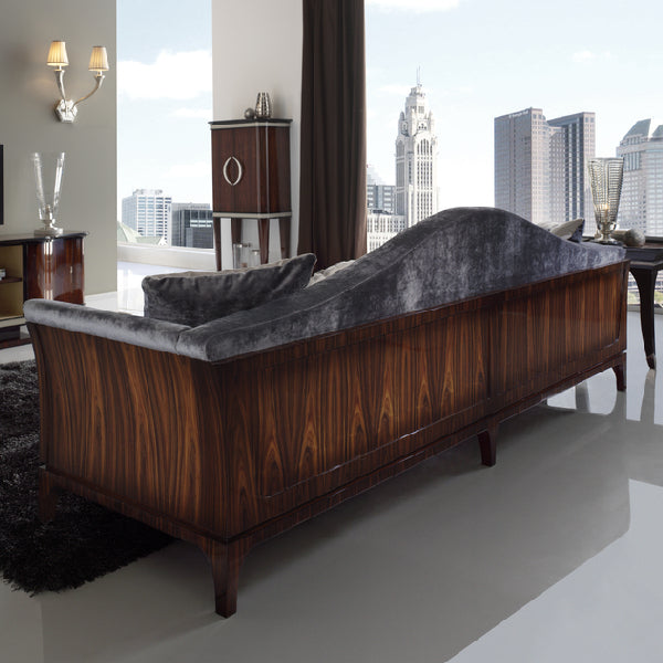 Elegant Curved Sofa with Luxurious Upholstery and Artistic Accents