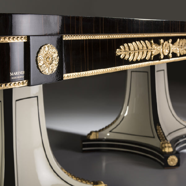 Sophisticated Black and Gold Dining Table with Mirrored Accents
