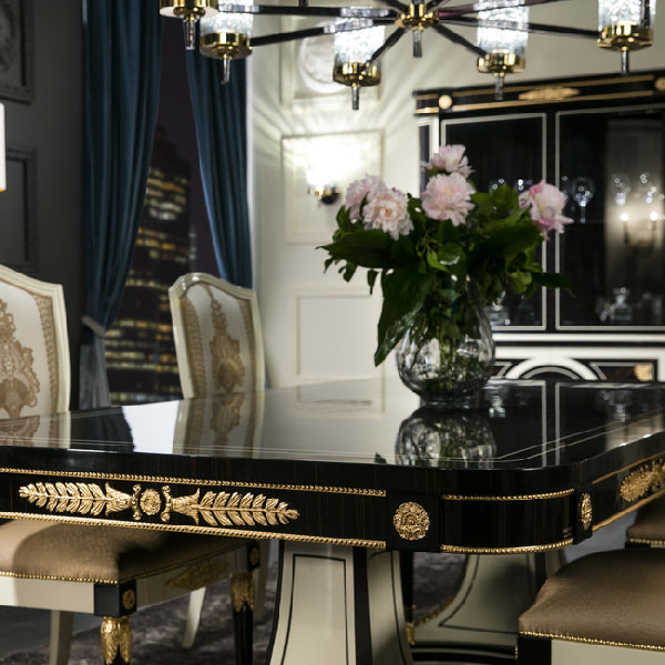 Sophisticated Black and Gold Dining Table with Mirrored Accents