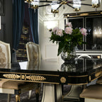 Sophisticated Black and Gold Dining Table with Mirrored Accents