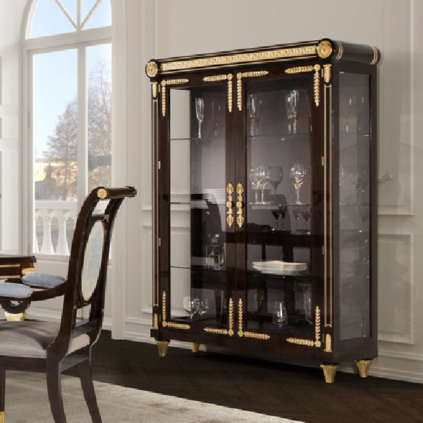 Elegant Display Cabinet with Glass Doors and Decorative Accents