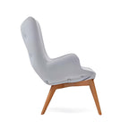 Contemporary Comfort: The Light Gray Tufted Accent Chair with Wooden Legs