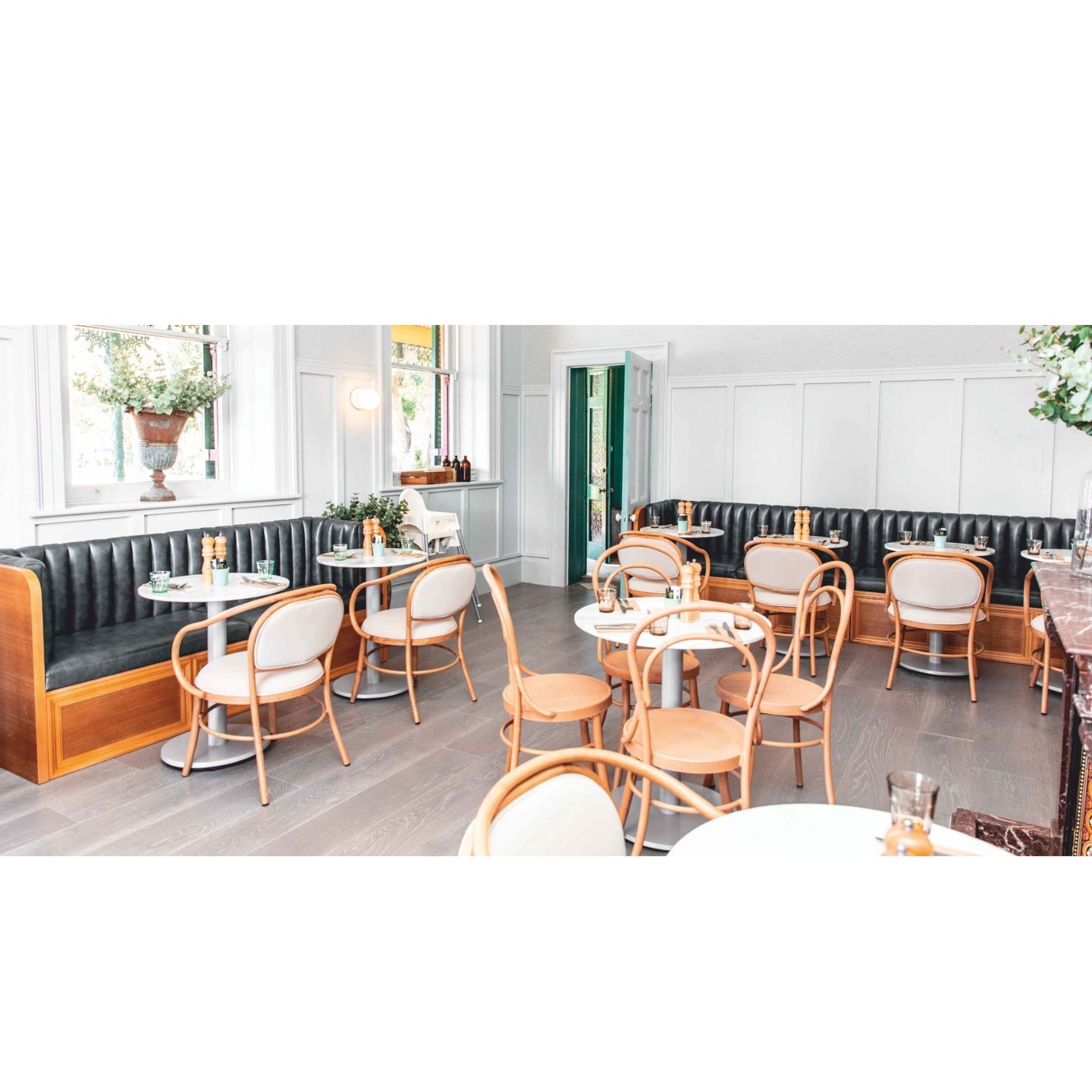 Chic Café Interior with Elegant Seating and Modern Décor