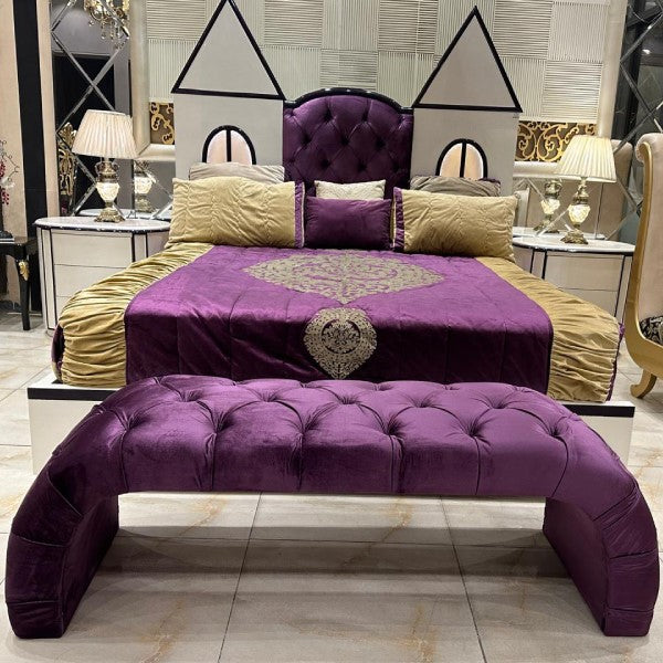 Royal Purple Velvet Bed with Golden Accents and Castle-Shaped Headboard