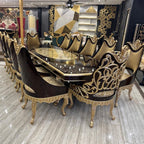 Royal Dining Table with Intricate Carvings and Matching Chairs