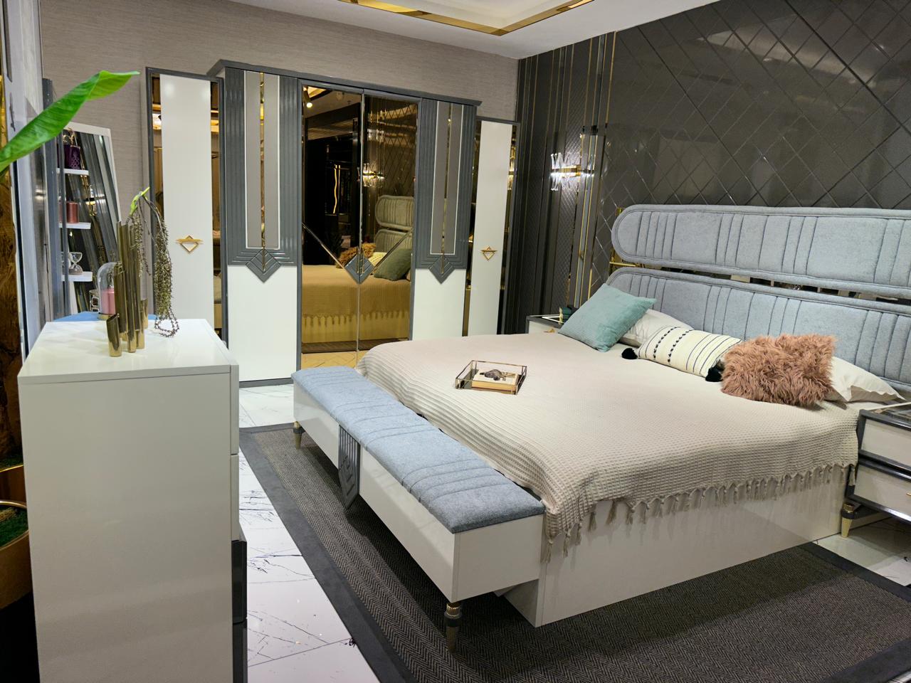 Elegant Modern Bedroom Suite with Plush Upholstery and Chic Accents