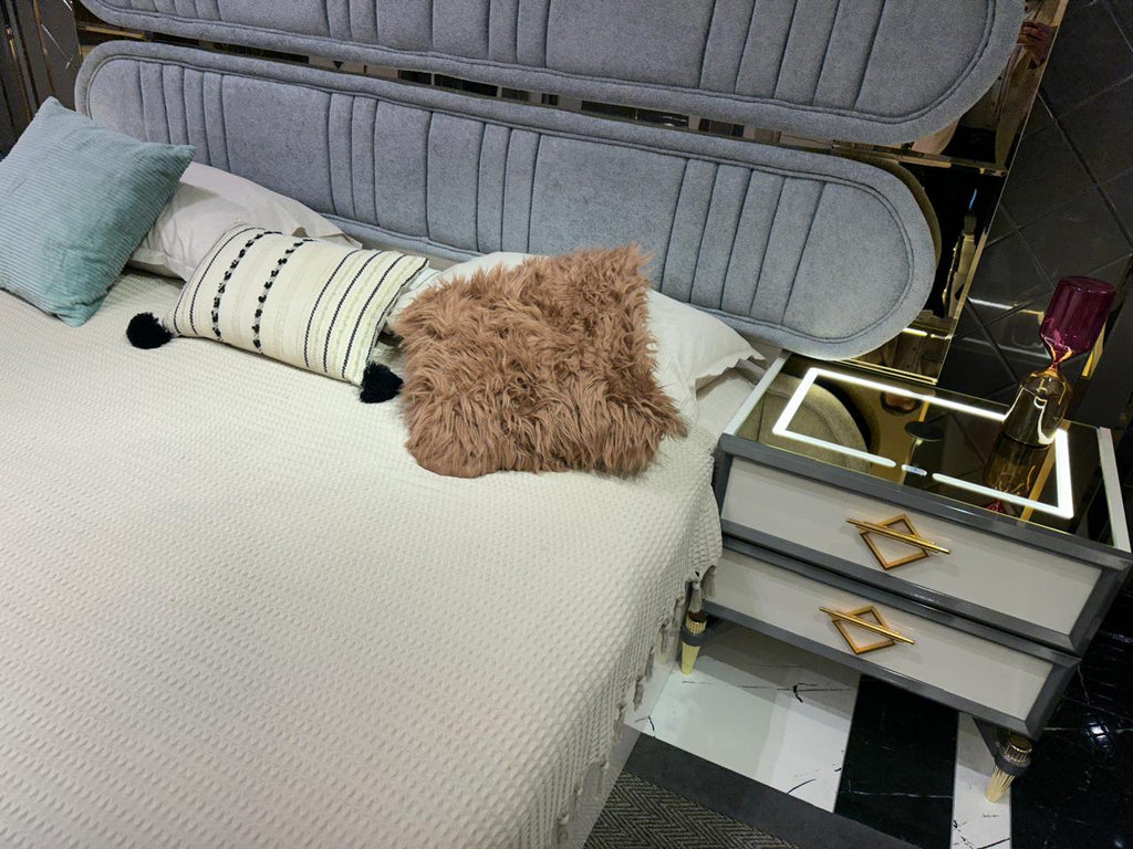 Elegant Modern Bedroom Suite with Plush Upholstery and Chic Accents